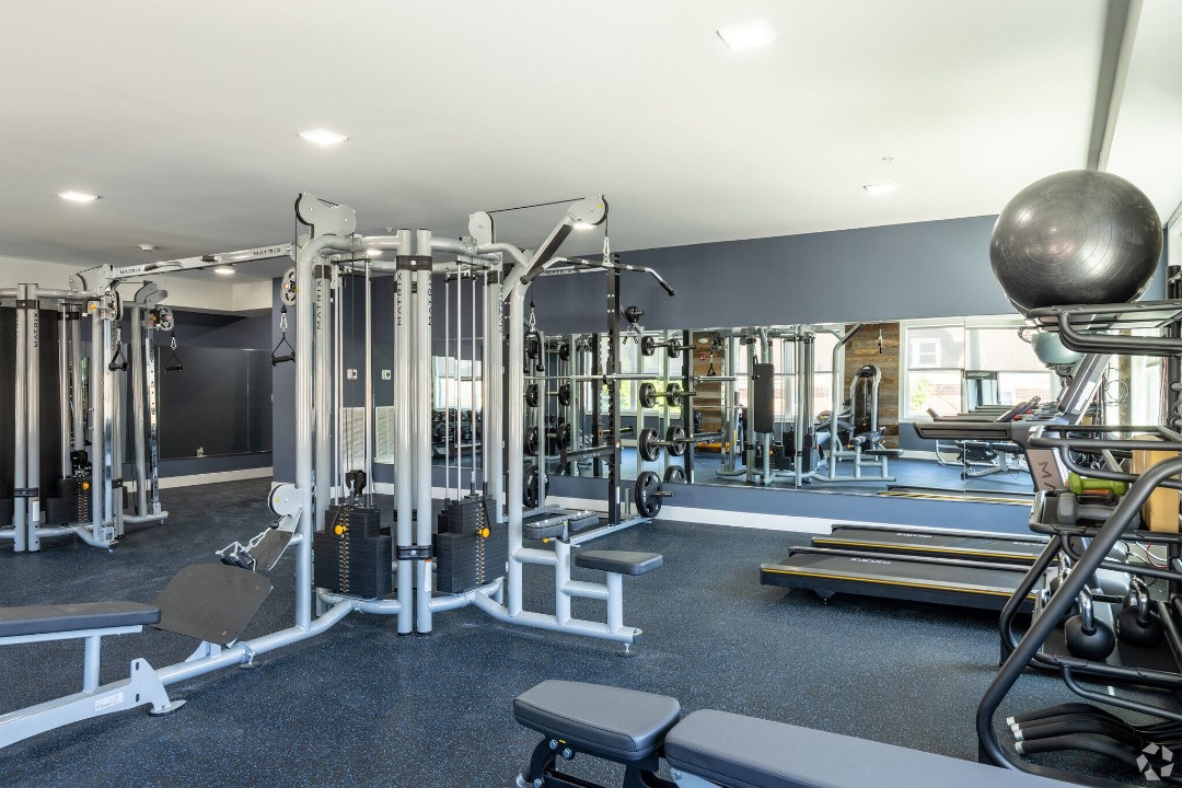 Fitness center with strength training equipment and treadmills